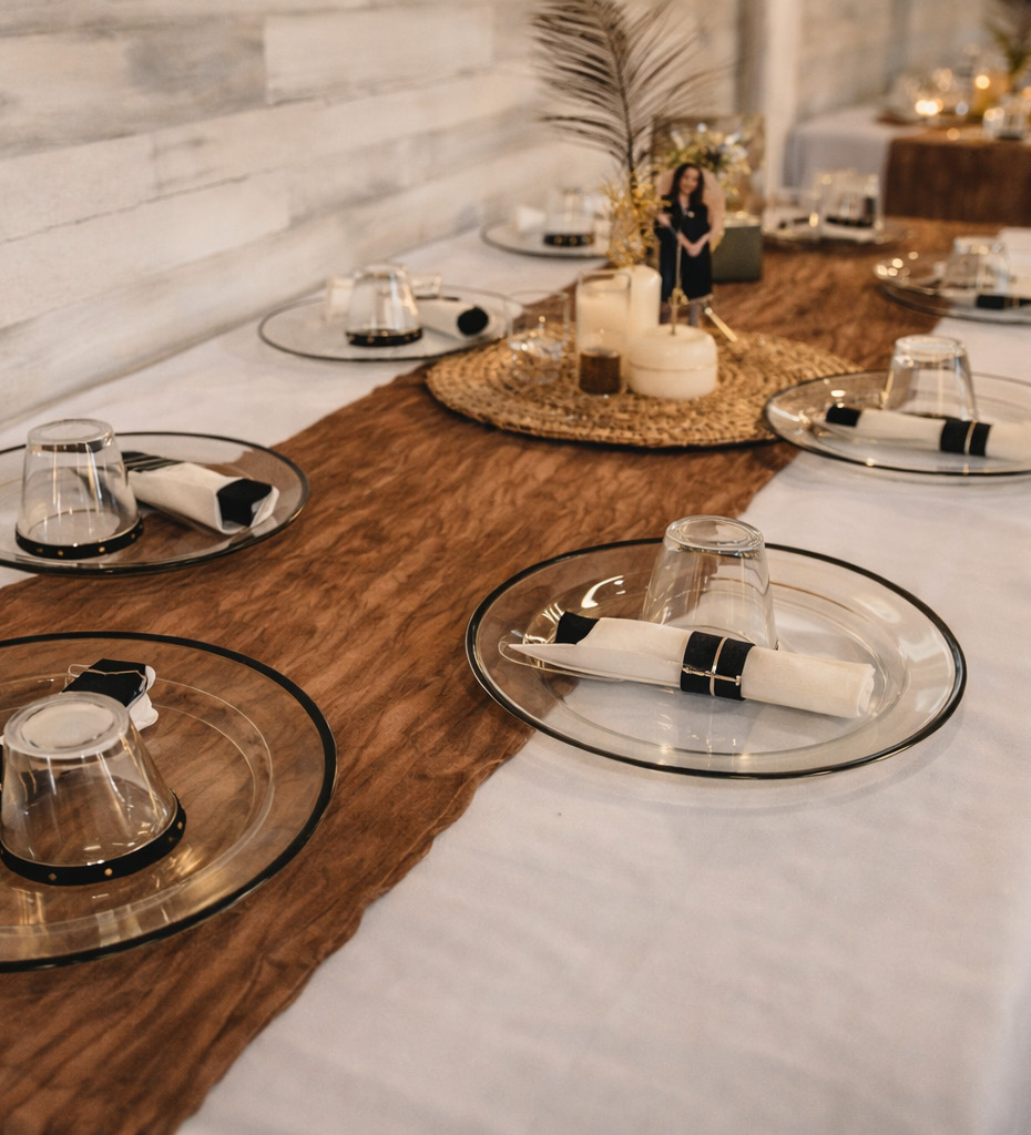 Styled tablescape with glass chargers and candles